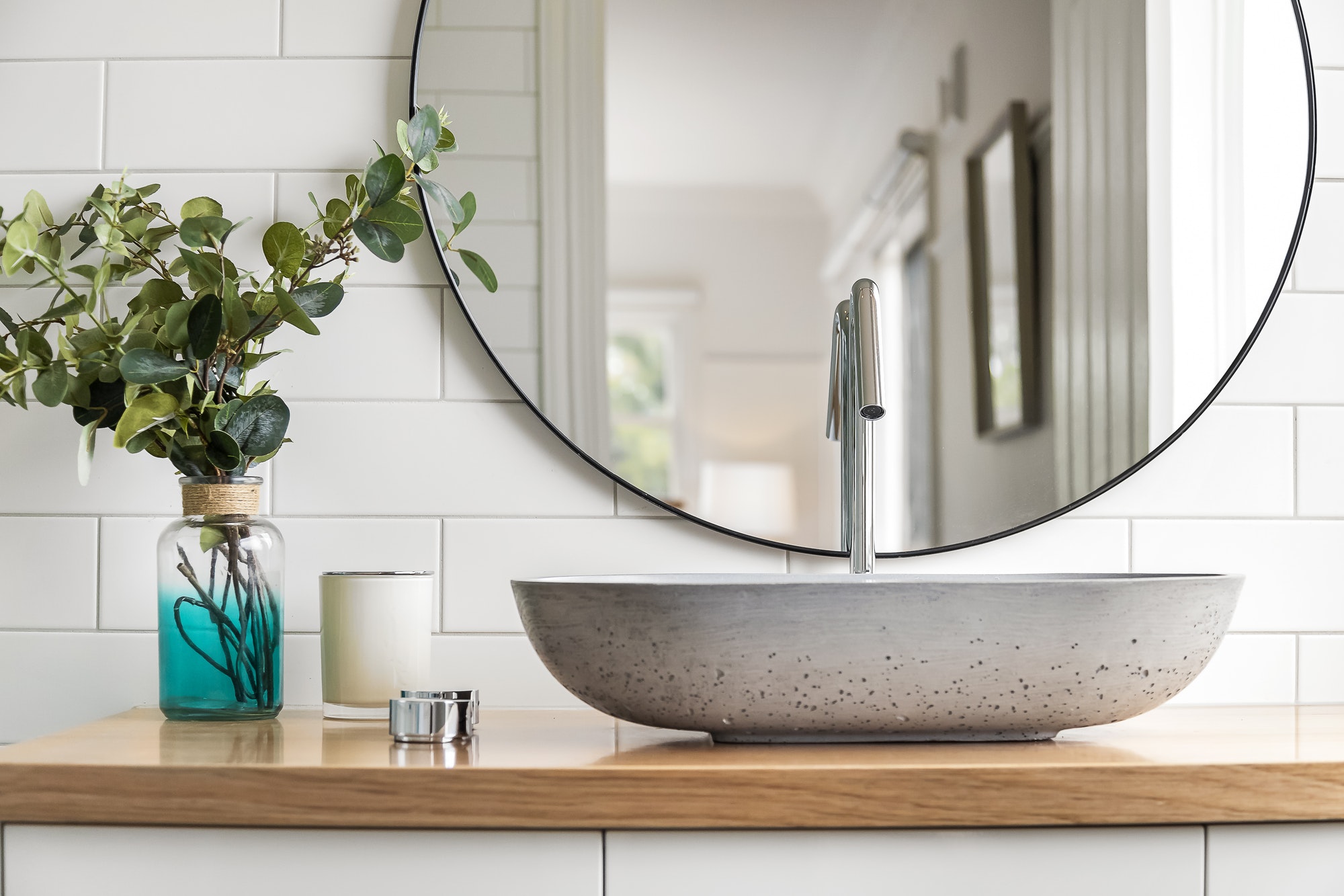 A basin and mirror in a modern bathroom
